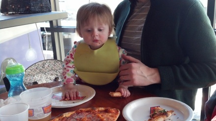 Lilli has discovered the wonders of pizza. 